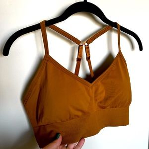Sleek and chic Lululemon Ebb to Street yoga bra in gorgeous gold color